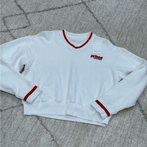 Sporty & Rich x Prince Collaboration. White and Red Sweater